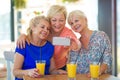 Group of senior friends taking a selfie Royalty Free Stock Photo