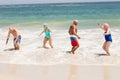 Senior friends playing in water Royalty Free Stock Photo