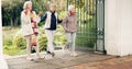 Senior friends, walking and talking together on an outdoor path to relax in nature with elderly women in retirement Royalty Free Stock Photo