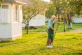 Senior gardener with rake. Royalty Free Stock Photo