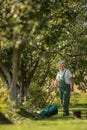 Senior gardenr gardening in his permaculture garden