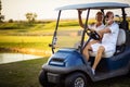 Senior golf`s couple in golf car