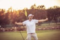 The senior golfer rejoiced at his victory. Royalty Free Stock Photo