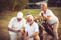 Golfers on court. Two men using smart phone Royalty Free Stock Photo