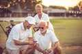 Senior golfers on court. Two men using smart phone Royalty Free Stock Photo