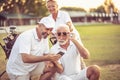 Senior golfers on court. Two men using smart phone Royalty Free Stock Photo