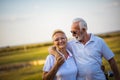 Golfers talking and walking on golf course Royalty Free Stock Photo