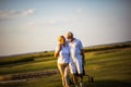 Golfers talking and walking on golf course Royalty Free Stock Photo