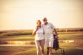 They playing always together. Senior golfers talking and walking on golf course Royalty Free Stock Photo