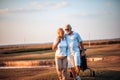 Golfers talking and walking on golf course Royalty Free Stock Photo