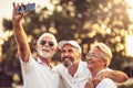 Golfers using phone and taking self portrait Royalty Free Stock Photo