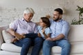 Senior grandpa, millennial father and boy enjoying family leisure time Royalty Free Stock Photo