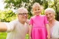 Senior grandparents and granddaughter selfie Royalty Free Stock Photo