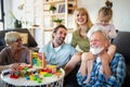 Senior grandparents playing with grandchildren and having fun with family Royalty Free Stock Photo