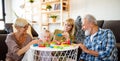 Senior grandparents playing with grandchildren and having fun with family Royalty Free Stock Photo