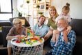 Senior grandparents playing with grandchildren and having fun with family Royalty Free Stock Photo