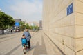 Senior and grandson on bike in sunny city morning,Chengdu