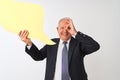 Senior grey-haired businessman holding speech bubble over isolated white background with happy face smiling doing ok sign with Royalty Free Stock Photo