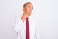 Senior grey-haired businessman wearing elegant tie over isolated white background with hand on chin thinking about question, Royalty Free Stock Photo