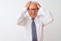 Senior grey-haired businessman wearing tie and glasses over isolated white background suffering from headache desperate and Royalty Free Stock Photo
