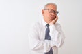 Senior grey-haired businessman wearing tie and glasses over isolated white background thinking looking tired and bored with Royalty Free Stock Photo