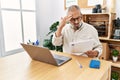 Senior grey-haired man stressed working at office Royalty Free Stock Photo