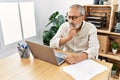 Senior grey-haired man stressed working at office Royalty Free Stock Photo