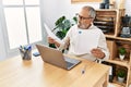 Senior grey-haired man stressed working at office Royalty Free Stock Photo