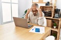 Senior grey-haired man stressed working at office Royalty Free Stock Photo