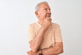 Senior grey-haired man wearing striped t-shirt standing over isolated white background with hand on chin thinking about question, Royalty Free Stock Photo