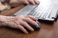 Senior hand using the mouse of a computer Royalty Free Stock Photo
