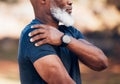 Senior hands, shoulder pain or injury in nature after accident, workout or training. Sports, health or elderly black man Royalty Free Stock Photo