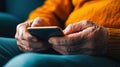 Senior Hands Using Smartphone Close-Up