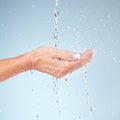 Senior hands, water splash for clean hygiene, fresh sustainability or wash against studio background. Hand of elderly Royalty Free Stock Photo