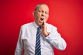 Senior handsome businessman wearing elegant tie standing over isolated red background touching mouth with hand with painful Royalty Free Stock Photo