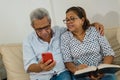 Senior happy couple having fun together with smart phone. Concept of active and modern elderly people during retirement Royalty Free Stock Photo