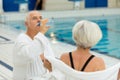 Senior happy couple in swimming pool Royalty Free Stock Photo
