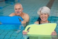 senior happy couple in swimming pool Royalty Free Stock Photo
