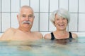 senior happy couple in swimming pool Royalty Free Stock Photo