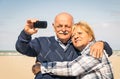 Senior happy couple taking a selfie at the beach Royalty Free Stock Photo