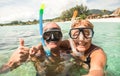 Senior happy couple taking selfie with scuba snorkeling masks