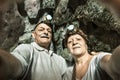 Senior happy couple taking a selfie at Tham Phum Cave in Laos