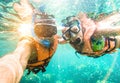 Senior happy couple taking selfie in tropical sea snorkel excursion Royalty Free Stock Photo