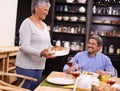 Senior, happy woman and family with turkey for thanksgiving dinner, meal or food at the table. Mature and hungry couple Royalty Free Stock Photo