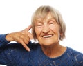 Senior happy woman is making a call me gesture Royalty Free Stock Photo