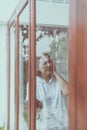Senior healthy concept,Mature asian elderly woman having migraine and headache pain near window at home Royalty Free Stock Photo