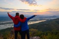 Senior healthy couple hiked the hill to see the sunrise view over Mekong river at Phu Pha Dak hill in Nong Khai Royalty Free Stock Photo