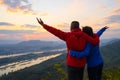 Senior healthy couple hiked the hill to see the sunrise view over Mekong river at Phu Pha Dak hill in Nong Khai Royalty Free Stock Photo