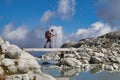 Senior hiker with backpack walking on glacier Royalty Free Stock Photo