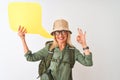 Senior hiker woman wearing canteen holding speech bubble over isolated white background doing ok sign with fingers, excellent Royalty Free Stock Photo